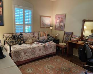 Looking across the office area, wonderful square rug, accent chair, more lamps, corner desk in two pieces