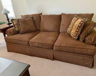 Brown with multicolor sofa available for pre-sell. Very clean very comfortable is upstairs.