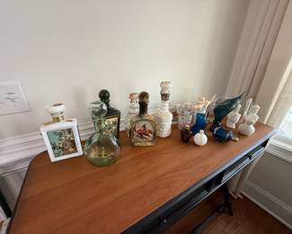 Vintage liquor bottles and Avon bottles. All sold separately.
