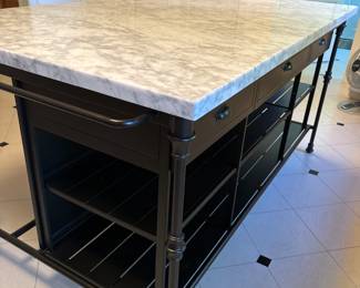 Top is one piece and bottom is three separate pieces for easy moving. 