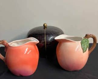 Tessellated Stone Bowl With Brass Inlays Over Mahogany Decor And Peach Pitchers
