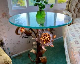 A side table with glowing metal flower feet? Sure, why not?