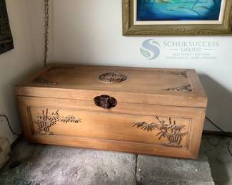 Light Brown Wooden Storage Chest with Carved Bamboo and Decorative Accents