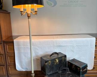 Vintage Black Storage Trunks and Gold-Toned Floor Lamp