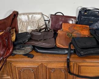 Diverse Collection of Handbags in Various Colors and Materials