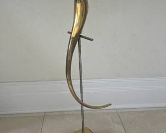 Vintage brass bird on a perch