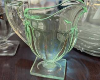 Queen Mary

Maker: Anchor Hocking Glass Co.

Circa: 1936–1949

Style: Pressed glass with vertical ribbing and square footed base

Clear under normal light, but glows green under UV