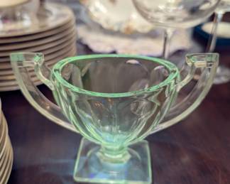 Queen Mary

Maker: Anchor Hocking Glass Co.

Circa: 1936–1949

Style: Pressed glass with vertical ribbing and square footed base

Clear under normal light, but glows green under UV