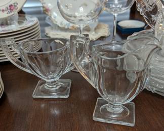 Queen Mary

Maker: Anchor Hocking Glass Co.

Circa: 1936–1949

Style: Pressed glass with vertical ribbing and square footed base

Clear under normal light, but glows green under UV