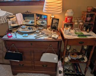 Vintage and antique vanity table accessories and a nice selection of candles.