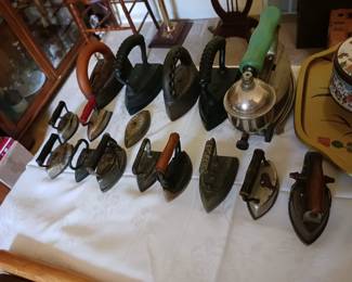  Sad irons with detachable handles and trivets often command higher prices.  $20 each
