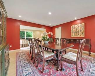 Mahogony Chippendale formal dining set with 2 leaves (not installed in this photo) and 12 chairs - Matching Sideboard and hutch also available in background - Art not for sale