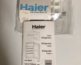 Instruction book and ice tray