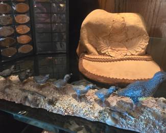 Mushroom cap, pennies, quail figurine