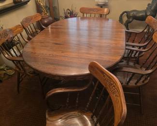 Solid Diningroom table with lg leaf & 6 armed chairs