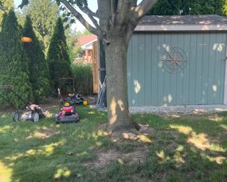 3 lawn mowers: not sure if they all work. Shed is full of garden type stuff. 