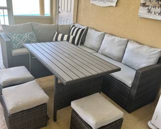 #90 - $700 - All weather wicker grey sofa lounging 70Wx24Dxc 86W with table 52Wx30Dx26H- 3 stools