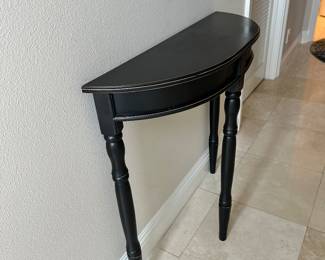 #11 - $60 - demilune black table 32Wx10Dx32H