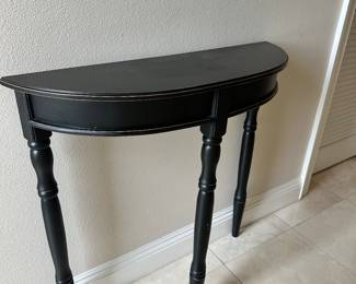 #11 - $60 - demilune black table 32Wx10Dx32H