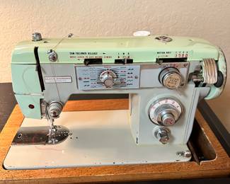 #116 - $280 - Black sewing cabinet with Singer sewing machine