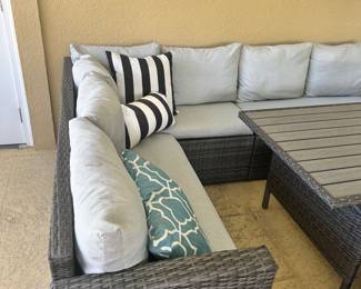 #90 - $700 - All weather wicker grey sofa lounging 70Wx24Dxc 86W with table 52Wx30Dx26H- 3 stools