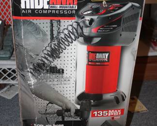 Hide away wall mountable air compressor