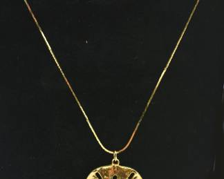 gold tone sand dollar necklace