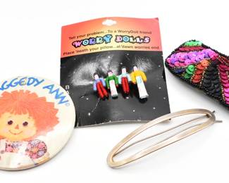 misc lot: worry doll barrette, Raggedy Ann pin, and 2 barrettes