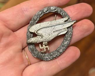 This is a Luftwaffe Paratrooper Badge, also known as a Fallschirmjäger Badge, from Nazi Germany awarded to qualified paratroopers during WWII.
