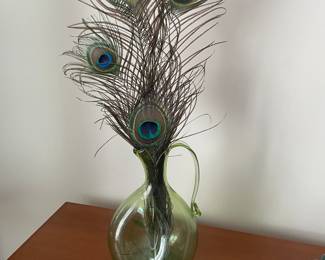 Beautiful blown glass vase with peacock feathers