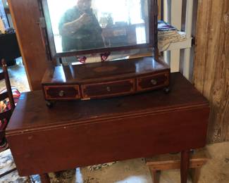 old drop leaf table in early paint