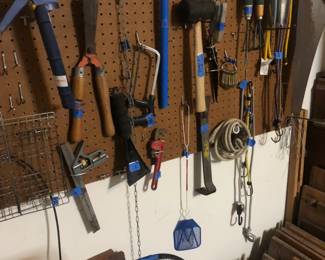 tools and a stack of antique small doors
