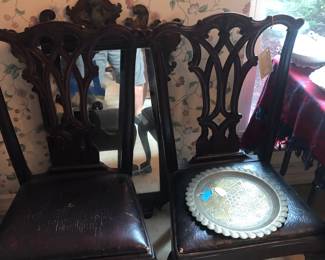 pair of Chippendale chairs and one of many mirrors