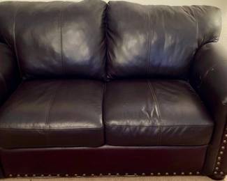 Burgundy Leather Nailhead Loveseat.