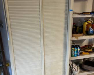 Garage sliding door cabinet