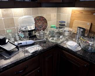 Many Kitchen accessories and cookware.