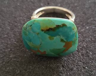 large turquoise ring.