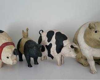 Artist Larry Koosey signed folk art pigs.
