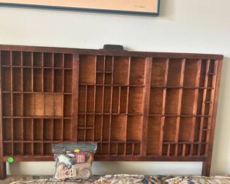 Typesetter drawer with vintage tins and clickers