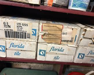 Several boxes of square white tile