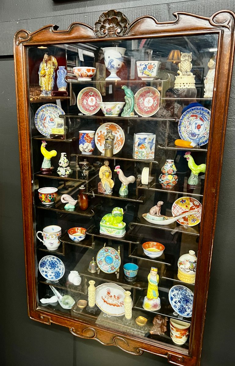 Wall hanging curio cabinet with contents
