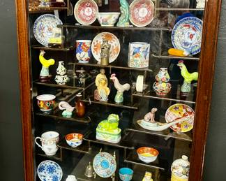 Wall hanging curio cabinet with contents 
