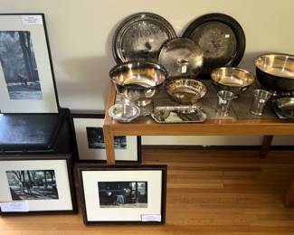 Framed prints, variety of horse racing trophies.