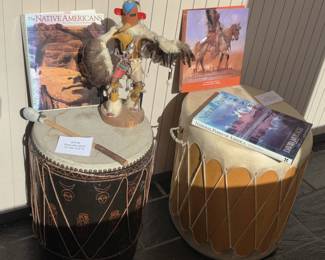 Native American drums, books and figure.