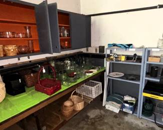 Baskets, metal shelving, clear glass flower vases, and fans.