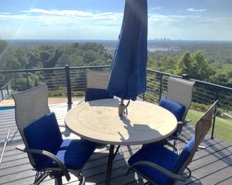 Patio table 54" round with four swivel chairs, cushions and umbrellas. BUY IT NOW! $200.