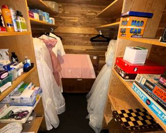 Vintage wedding dresses, games, cedar chest.