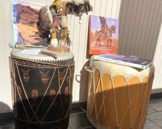 Native American drums, books and figure.