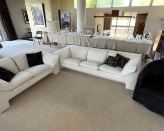The main room has designer upholstered furniture. n. eilersen cream colored sofa 94"w x 36"d x 26"h loveseat 69" w x 36"d x 26"h Micro suede swivel club chair 30"w x 31"d x 32"h