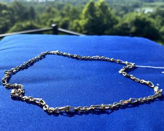 Heavy, thick 14 kt. gold necklace.